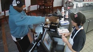 Watch Unfazed Cashier Keep His Cool During Terrifying Gunpoint Robbery [upl. by Ahsar]